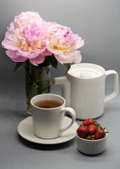 Сup of tea, peony and berries.