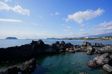 Fototapeta na wymiar rock coast and island in the sunlight