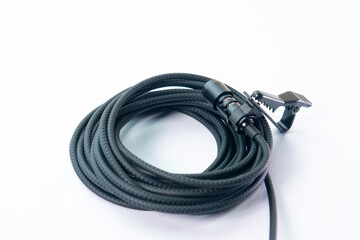 clip on microphone with braided cable isolated on white background