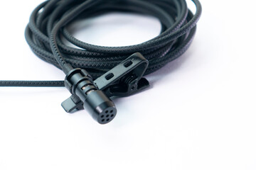 clip on microphone with braided cable isolated on white background