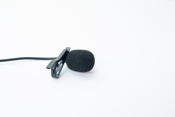 clip on microphone with windshield foam and braided cable isolated on white background