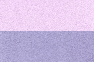Texture of craft light purple and lilac paper background, half two colors, macro. Structure of vintage violet cardboard.