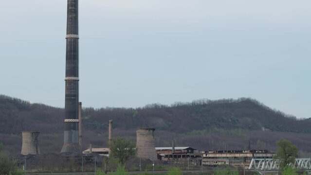 Slow pan across abandoned zinc smelting factory in Copsa Mica, Romania