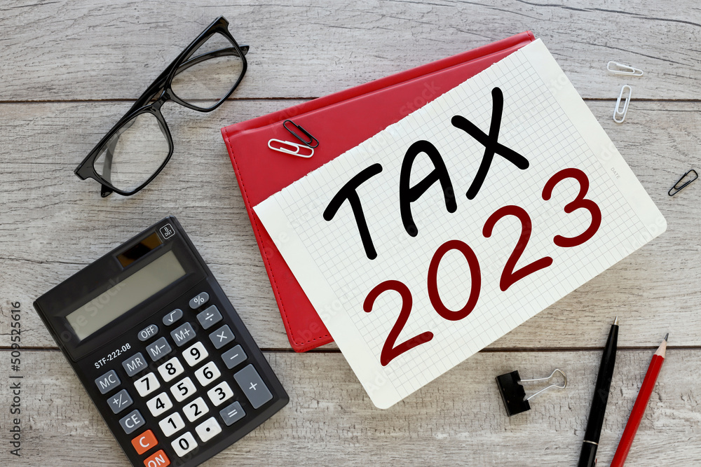 Poster taxes 2023 red notepad with text on the table