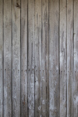 Front view of an old, weathered and aged wooden wall. Abstract full frame textured background.