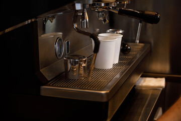 Close up view of preparing coffee espresso in automatic coffee machine in cafe