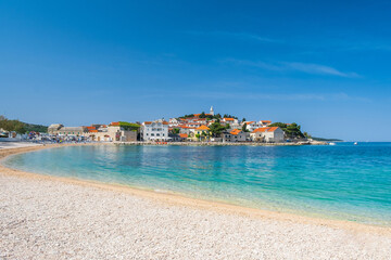 Sand beach in front of old town of Primosten, Dalmatia, Croatia, Europe