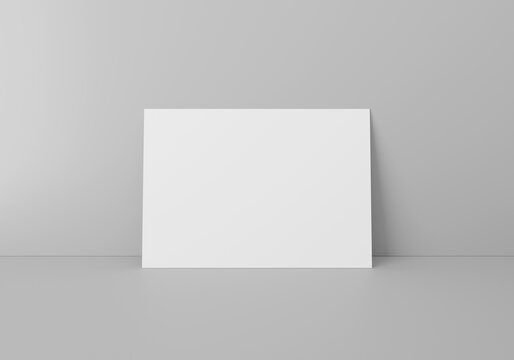 Empty white horizontal rectangle A4 paper sheet mockup on floor over grey wall, 3D rendering