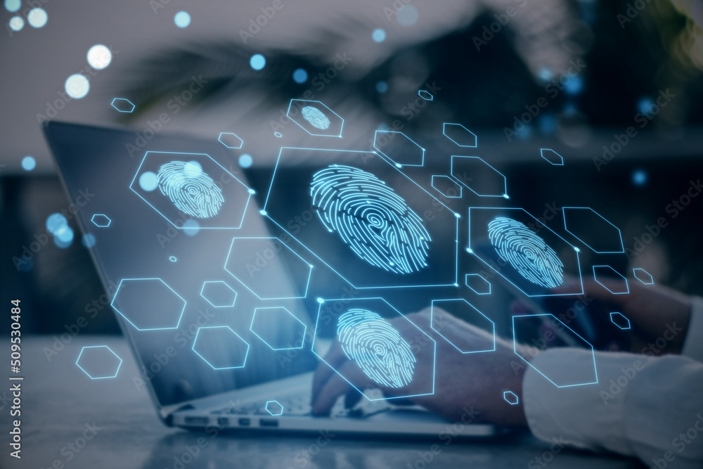 Poster Close up of businessman hand using laptop and cellphone with creative digital fingerprint hologram on blurry background with lines. Cyber datanase and access concept. Double exposure.