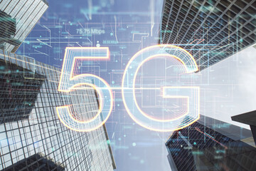 Front view on 5G digital glowing symbols on modern skyscraper tops background, 5G network wireless internet connection and communication network concept, double exposure