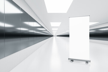 Modern white underground corridor with empty white roll up banner for advertisement, ceiling lights. Subway and station concept. 3D Rendering.