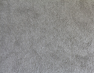 Grey soft carpet in monochromatic color. Textile carpeting. Abstract texture background.