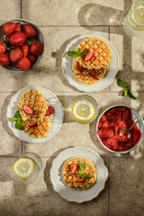 waffles with strawberries and sauce