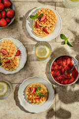 waffles with strawberries and sauce