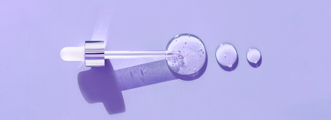 pipette drop of serum test on a purpule background	
 - obrazy, fototapety, plakaty