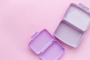 Empty purple lunch boxes, top view. Plastic container for food