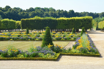Obraz premium Title: The Marlborough Tower and pond in the Queen s Hamlet at Marie-Antoinette s Estate near Versailles Palace.