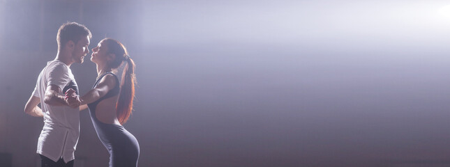 Banner active happy adults dancing bachata together in dance class copy space and place for advertising