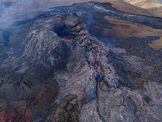 Volcanic crater in Iceland. active volcano on Reykjanes peninsula by day. Dark magma rock around...