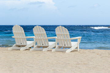 White chairs on tropical beach