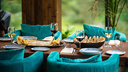 Served restaurant table with wine drinks and food