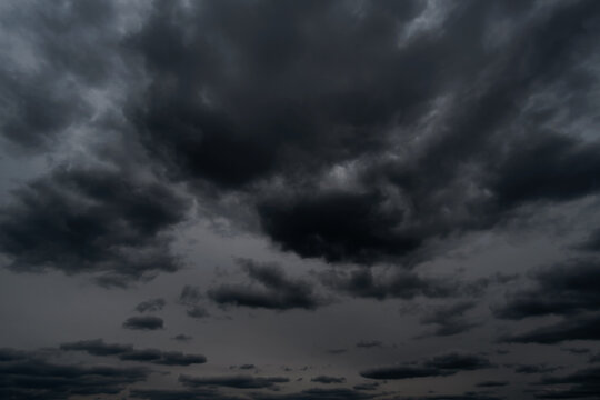 background of dark dramatic sky with stormy clouds before rain or snow, extreme weather