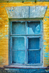 Window with broken glass in an old house