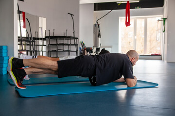 Man and   woman strengthen their hands during fitness training