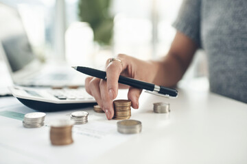 How financially savvy are you. Closeup shot of an unrecognisable businesswoman calculating finances...