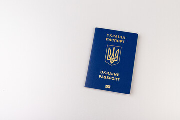 Ukrainian passport with a golden trident symbol on light background. Biometric Ukraine passport id empty place for photo or text.