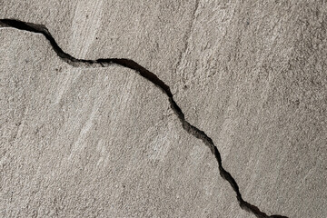 Diagonal crack in plaster on a wall
