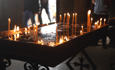 Burning candles in a church.