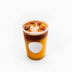 Plastic wet glass with cold coffee glace with ice cubes on a white background, close-up. Mock up