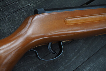 Close up of the trigger of the weapon. Top view of an air pistol. The concept of use and protection...