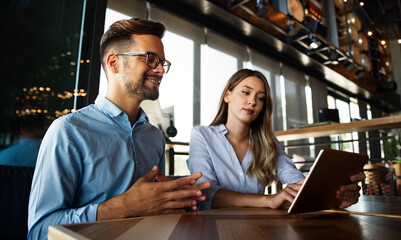 Business colleagues having conversation during coffee break