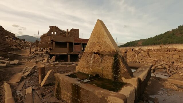 Emerged abandoned city of Aceredo during drought with working drink fountain