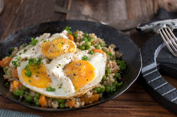 Bodybuilding meal with fried eggs, brown rice and vegetables for muscle building
