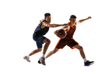Fototapeta na wymiar Portrait of two sportive men, basketball players in uniform playing, training isolated over white studio background