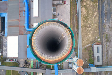 Coal power plant after decommissioning. Aerial, vertical view inside the chimney of a power plant....