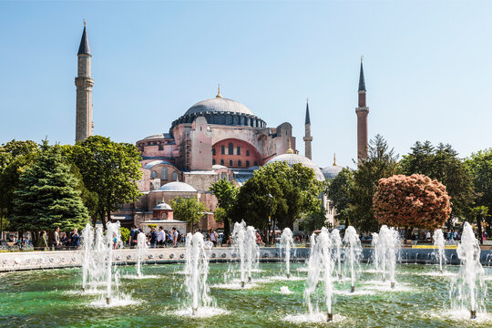 View of Sultanahmet district with fountain in the center and Hagia Sophia mosque (former orthodox cathedral in the Byzantine Empire) in the background. Istanbul, Turkey
