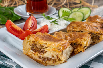 Traditional delicious Turkish cuisine, Turkish food; handmade mince pie, served with tea