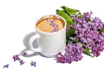 Cup of coffee and lilac flowers bouquet isolated on a white background. Breakfast springtime concept