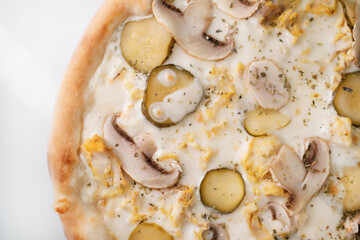 Italian pizza with mushrooms and cheese close-up.