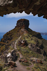 Skaros rock in Santorini. Image framed by another section of rock in the foreground