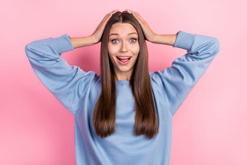 Portrait of attractive amazed cheerful girl great news reaction incredible isolated over pink pastel color background
