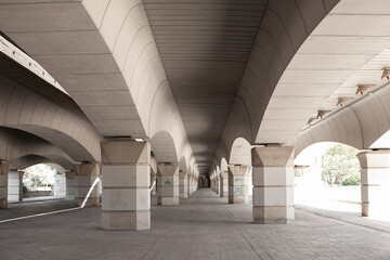concrete corridor under the bridge, architecture perspective in neutral colours