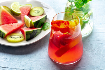 Summer cocktails. Cold drinks with fresh fruits. Healthy mocktails. Glasses of lemonade with ice and watermelon