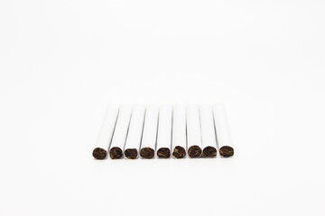Cigarettes Lined Up on a White Background