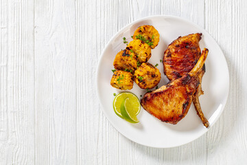 roast tomahawk pork chop with corn disks