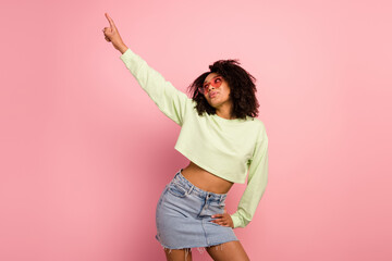 Photo of young pretty girl good mood carefree hang-out look empty space isolated over pink color background